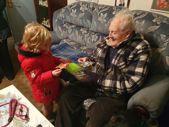 Enjoying Christmas cookies made by Sofia!