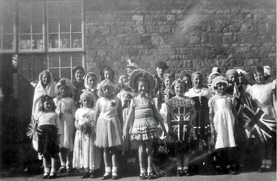 VJ Day Fancy Dress Comp. 1945. Sheila centre back row wearing Dad's cap.