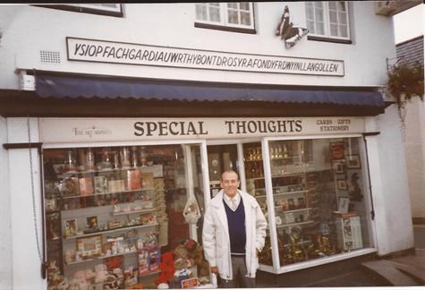 Dad outside a souvenier shop in a place in wales that we failed to pronounce correctly x