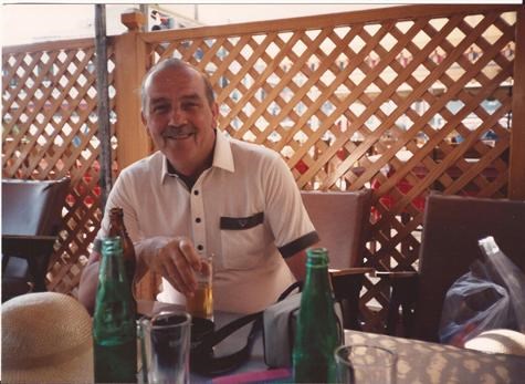 Dad enjoying a refreshing lager in a greek taverner