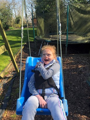 Ella enjoying a swing from Granny 