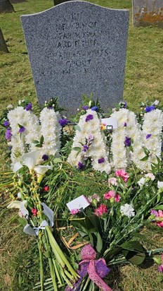 Flowers on Charlie's grave waiting for mum's ashes. £75 donated to Devon Air Ambulance.