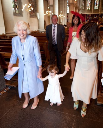 Holding the hand of her mini-me, youngest Grandchild, Dolly