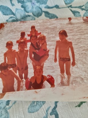 A very young james with his brothers and sister 