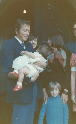 Dave, the Godfather, holding Emma at her Baptism, Sept 1974