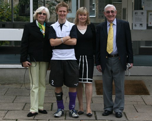 Colin and family watching Alex play hockey for his University