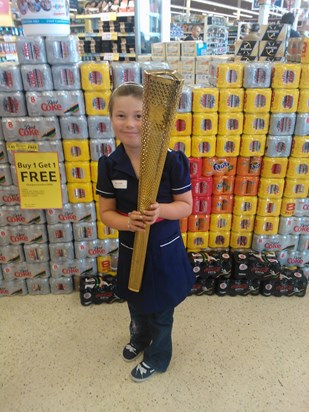 Christina, aged 7, with the Olympic Torch