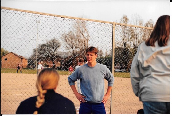 Dale doing his Superman impression to Tina just before a softball game.