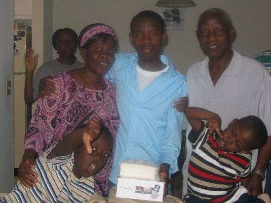 Grandpa with Opeyemi, Tunji, Timi and Grandma during Ope's first birthday in the US