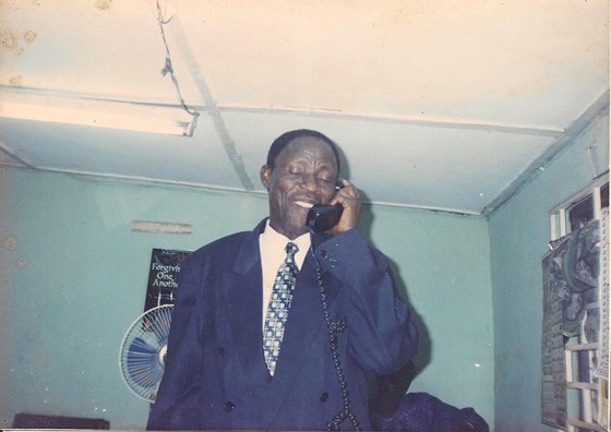 On the phone during his service @ Baptist Building, Ibadan
