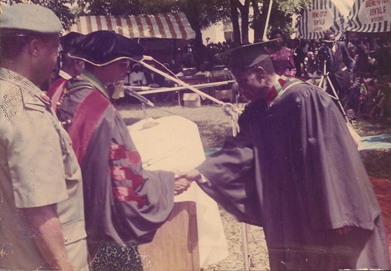 Accepting his certificate during graduation at U.I