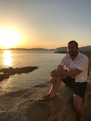 About 2 minutes before he proposed to me, drinking cocktails at sunset in Sardinia