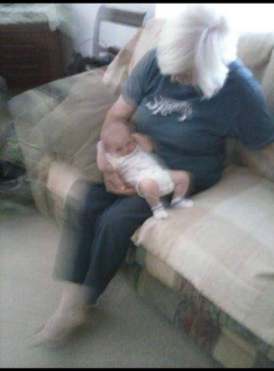 grandma dee holding baby falling asleep