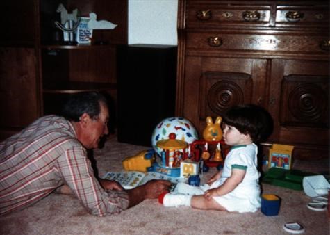 Grandpa Gil with beloved granddaughter Samantha playing on the floor 1988.