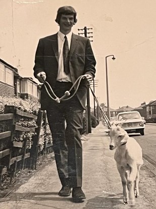 Dad and his pet goat