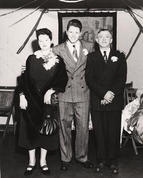 Harvey with his parents at high school graduation