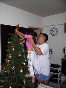 Putting up the star on our first Christmas tree