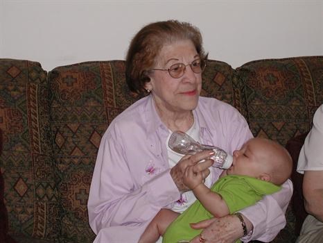 Mom with a bottle and great grandson Mason i think