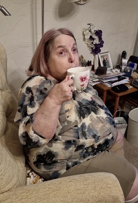 Linda enjoying a coffee