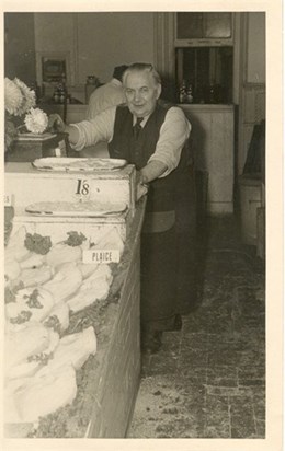 Geoff’s Grandad at the fish shop at Crouch End. Geoff lived above the shop with his parents and siblings