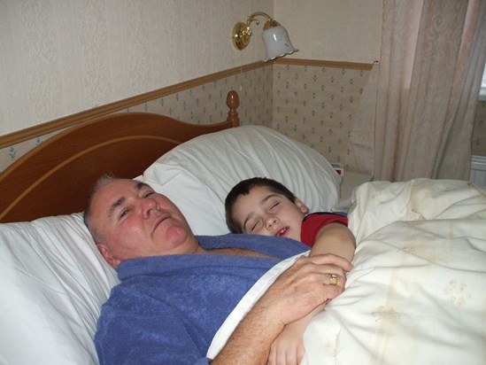 Grandad enjoying sleepy cuddles with Connor