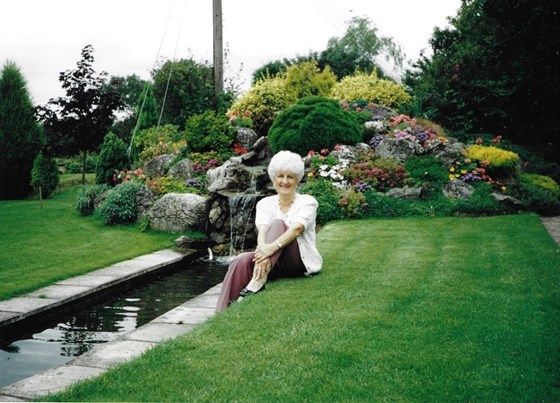 Janet siting in the garden at the Old Forge 