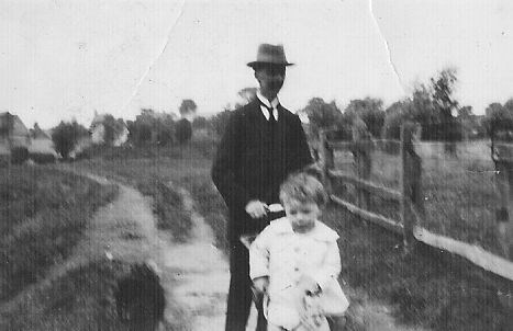 Dad being pushed by Grandpa in Uffington Meadows c1925