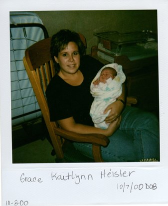 Tina holding Grace for the first time
