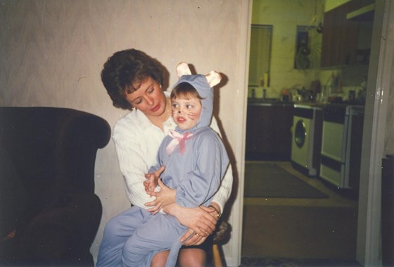 Me sitting on Mum's lap dressed as a Mouse for a Ballet show