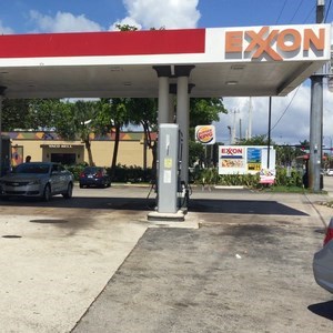 Toyota Prius  car filling up  with petrol at a  Tallahassee petrol station