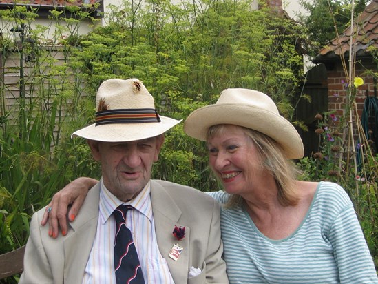 In the garden with our battered Panama hats after planting the next batch of seeds together. 