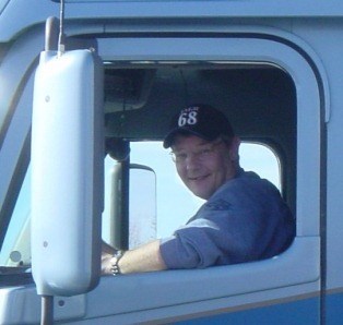 Trucker David driving a big rig in Nebraska November 2002. Miss you my friend.