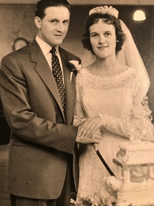 Mum with Dad cutting cake