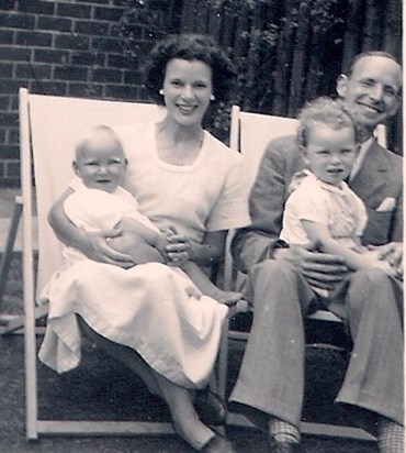 Brendan on father’s knee and mother holding baby brother Patrick