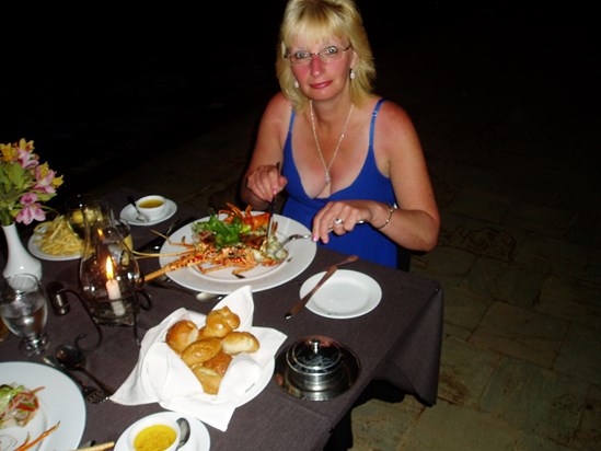 Angie & Simon having lobster, crab, prawns and chips by the pool on their Wedding Day