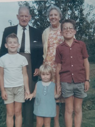 Front row: Peter aged 7 (left) with Mary and David Cowlett