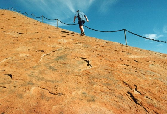 Pete scaling Uluru (Ayers Rock) in Australia