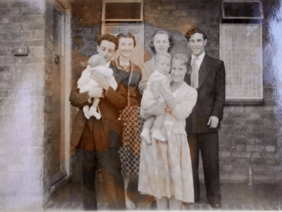 Family with auntie Margaret holding baby Richard
