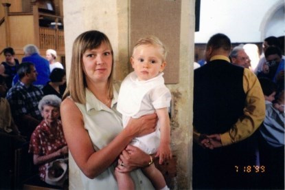 Claire holding her godchild Darius at the christening