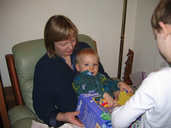 Claire holding her nephew Marcus at Christmas