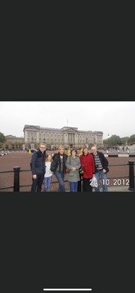 Mum with family outside Buckingham palace.