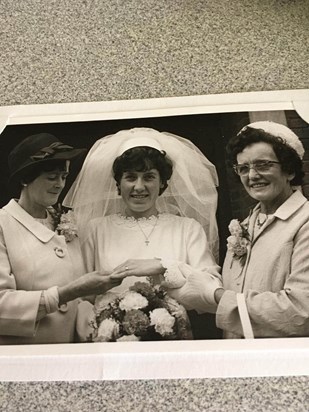 Mum with her mum and mother in law on wedding day.