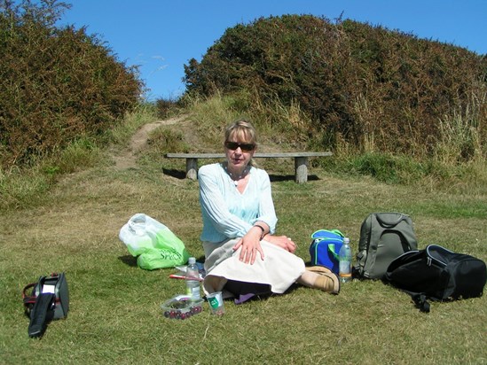 On one of the Umbrella day trips to Hastings, on the East cliffs, a classic pose who's the famous person behind the Dark Glasses'