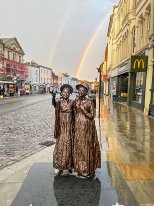 The statue finally finished, with a double rainbow overhead 