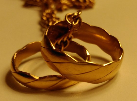 Our Wedding rings, which I hold tight every night.