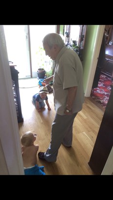 Toby and Isaac running rings around Grandad