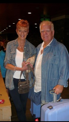 Looking tanned & happy - Eve & Mick returning from their travels 