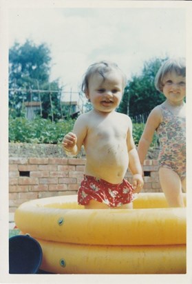 James & his sister Claire in the paddling pool.