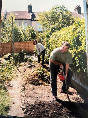 2002 in the Greens garden with Father Thomas Wronski