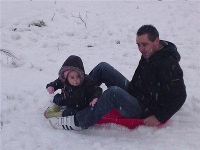 Rhianna with her grandad in the snow